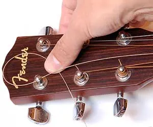 Guitar being restrung